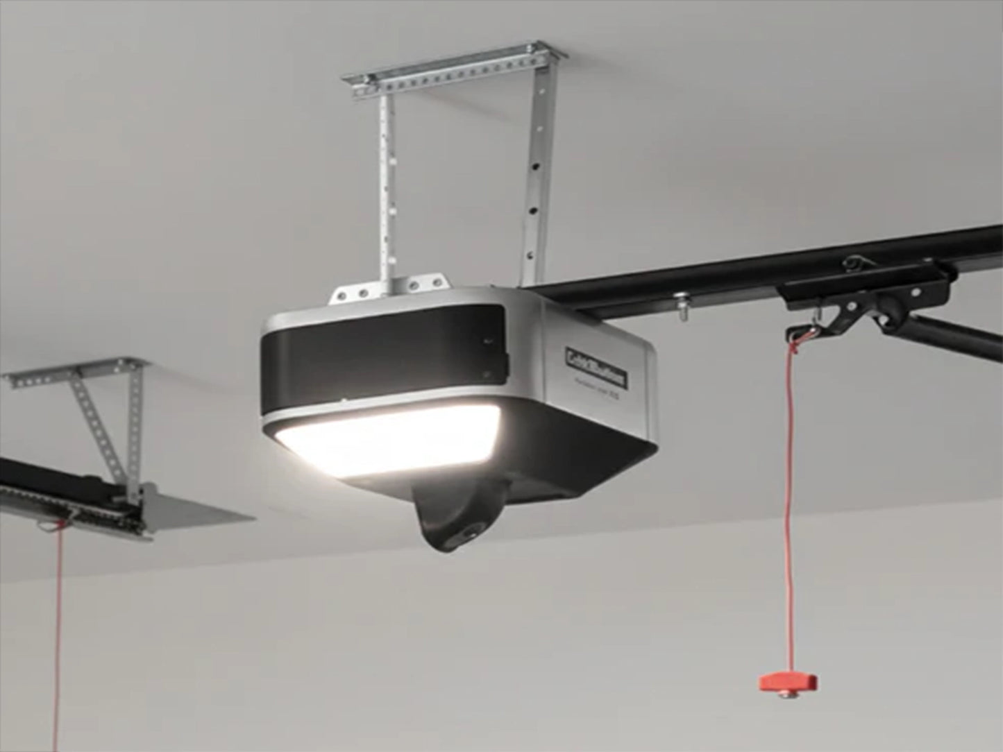 LiftMaster 6580L Belt Drive Smart Garage Door Opener mounted to a ceiling, featuring the head unit with a bright integrated LED light. Thumbnails display the included 3-button remote (993S) and wireless keypad (L979S), with a base price of $450.93.