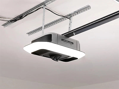 LiftMaster 6690L smart garage door opener with a built-in camera and integrated LED light mounted on a ceiling.